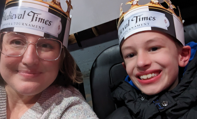 Jennifer and her son wearing Medieval Times crowns