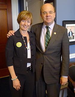 Rep. Jim McGovern poses with advocate. 